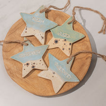 Load image into Gallery viewer, Four Island Aura hanging Channel Islands ceramic stars with a coastal glaze, Alderney, Guernsey, Herm and Sark
