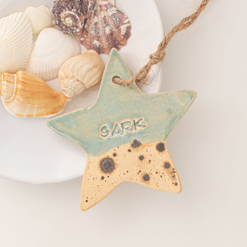 Island Aura hanging Sark ceramic star with a coastal glaze